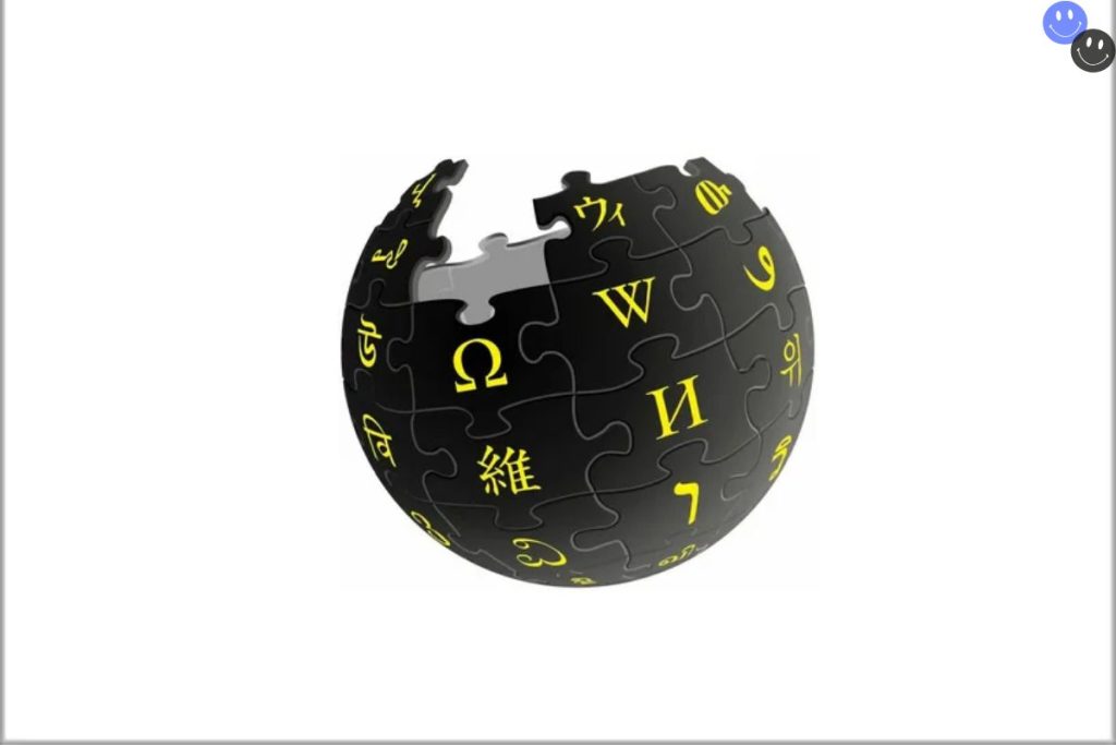 A stylized version of the iconic Vkipedia globe logo, featuring black puzzle pieces with yellow letters from different writing systems. The globe appears incomplete with a missing piece at the top, symbolizing the collaborative nature of the platform.